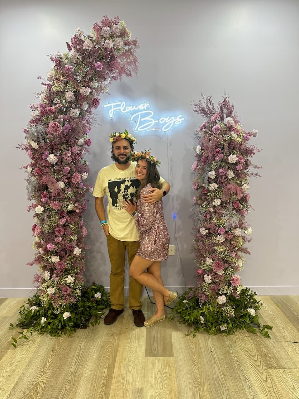 Showing off the flower crowns we made at a local florist’s Eras-themed workshop